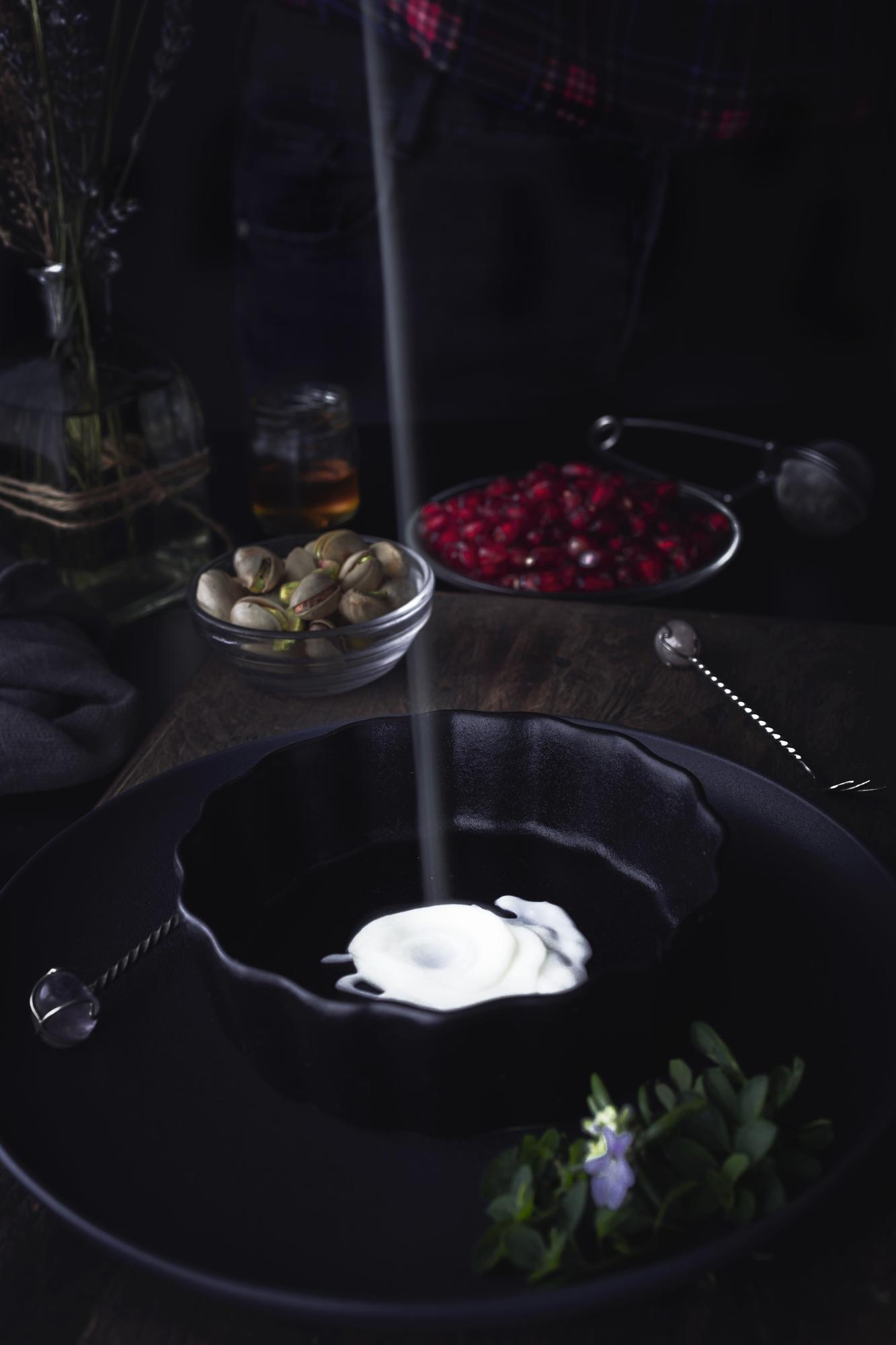Large editorial: plated tasting menu on dark table